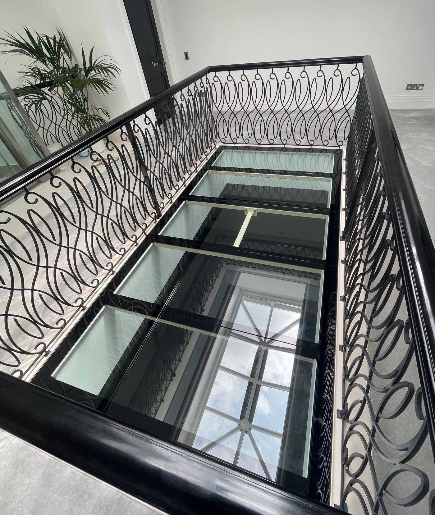 large glass floor in london townhouse used to make gallery landing safe for children
