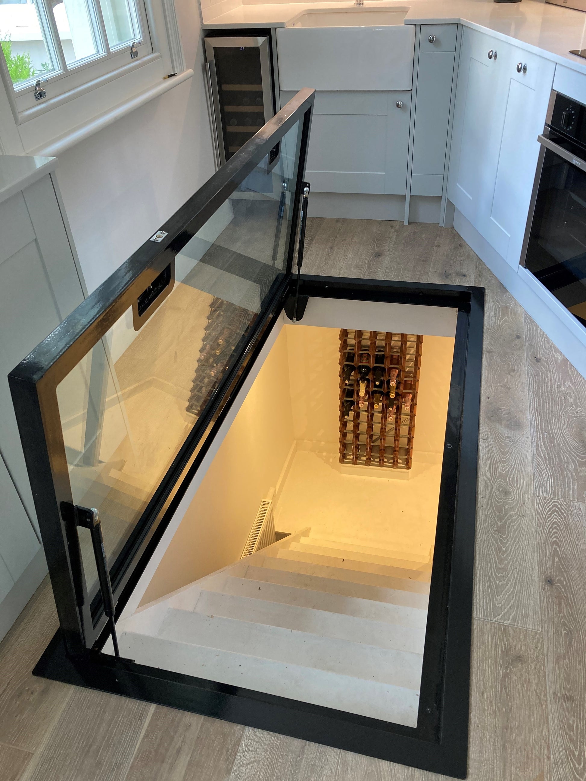 large kitchen glass basement access door hatch