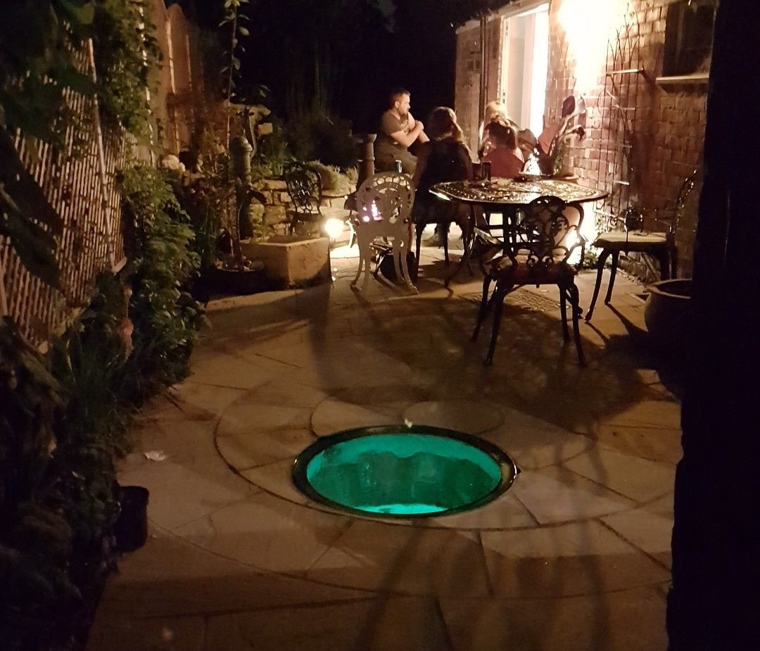 external glass well cover in paving floor with steel frame support
