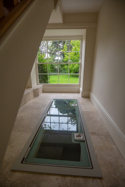 Light grey painted glass border by Glass Floor Systems Ltd with greenish tint effect.