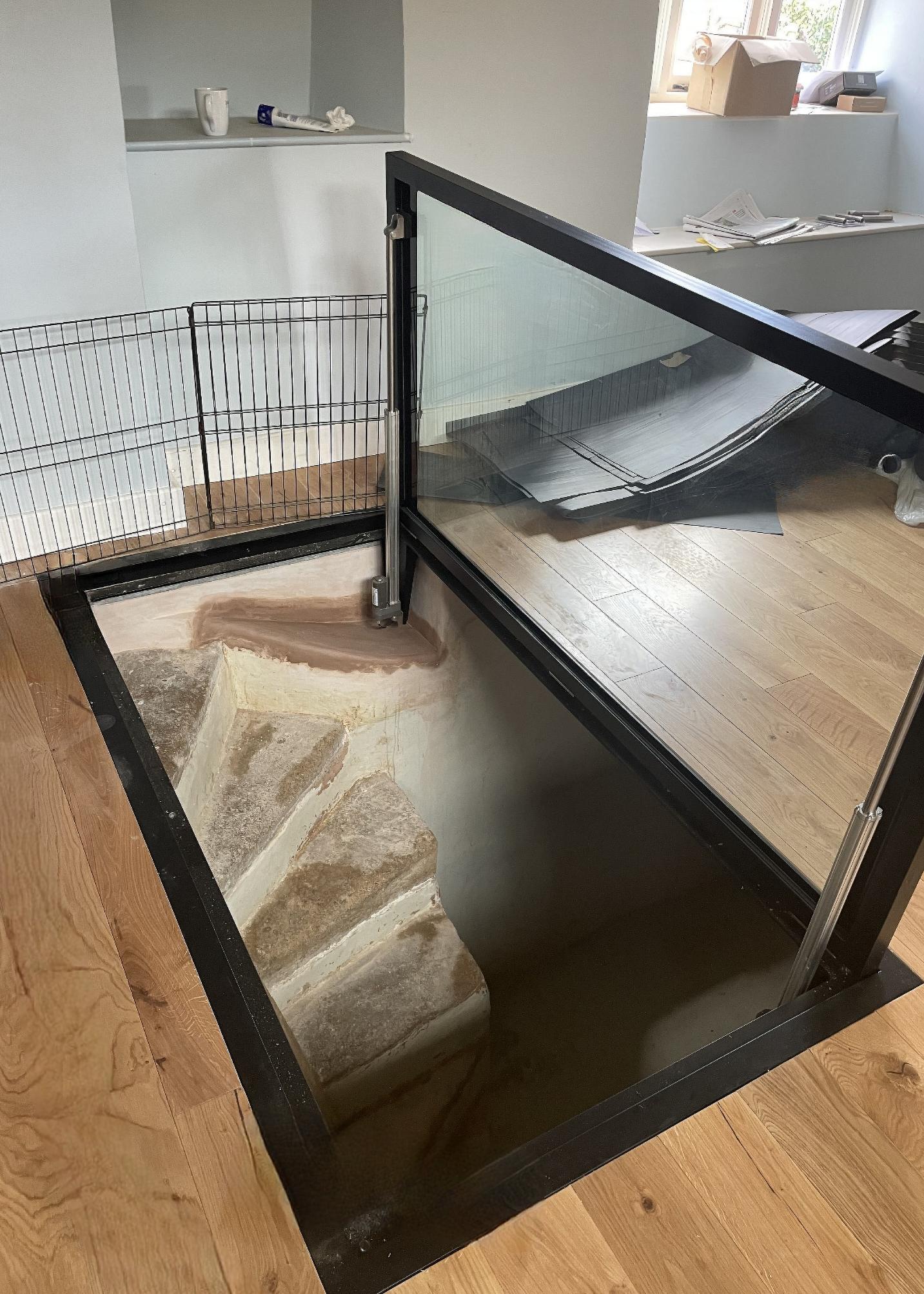 electric motorised glass basement door with actuators