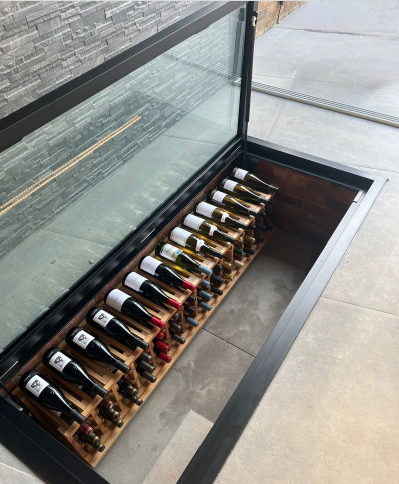internal kitchen wine cellar storage display glass floor hatch
